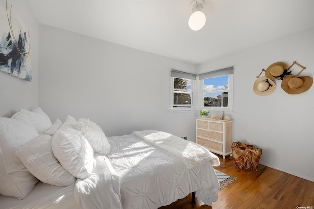 bedroom with wood-type flooring