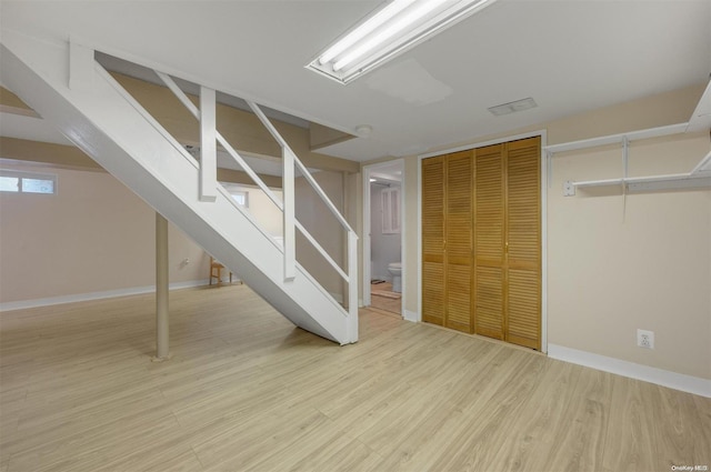 basement featuring light hardwood / wood-style flooring