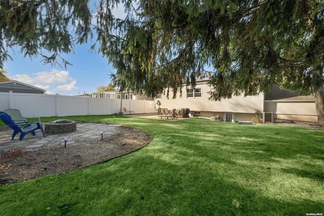 view of yard featuring a patio and an outdoor fire pit