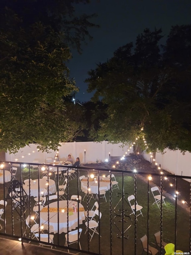 view of balcony at twilight