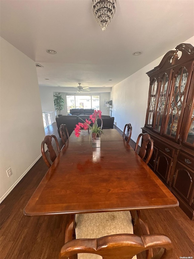 dining area with hardwood / wood-style floors and ceiling fan