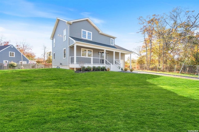 view of front of property with a porch and a front lawn