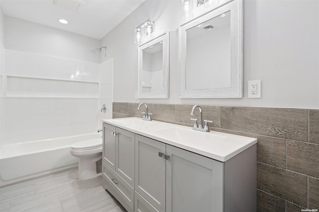 full bathroom with vanity, toilet, and tub / shower combination