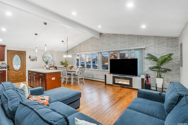 living room featuring vaulted ceiling with beams, light hardwood / wood-style floors, a baseboard radiator, and brick wall