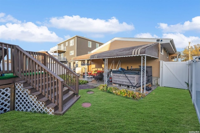 exterior space featuring a patio area and a hot tub