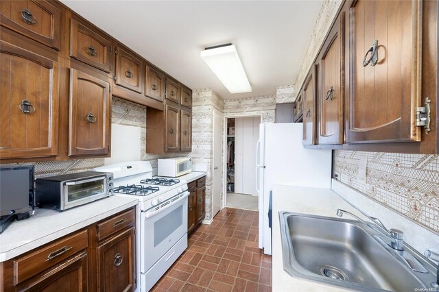 23-20 Bell Blvd Unit 5F, Bayside, NY 11360 - kitchen featuring white appliances, a sink, light countertops, and decorative backsplash