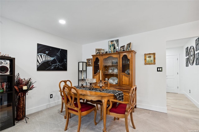 dining area with light carpet