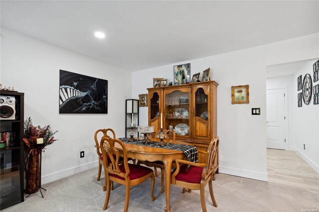 655 Middle Country Rd Unit 8D2, Coram, NY 11727 - dining space featuring light carpet and recessed lighting