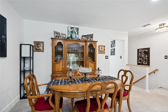 655 Middle Country Rd Unit 8D2, Coram, NY 11727 - dining room featuring light carpet and baseboards