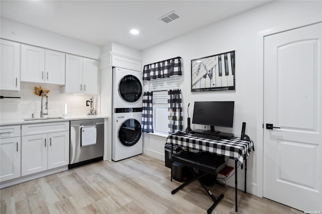655 Middle Country Rd Unit 8D2, Coram, NY 11727 - washroom with stacked washer and clothes dryer, light wood-type flooring, and recessed lighting