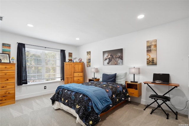 bedroom featuring light colored carpet