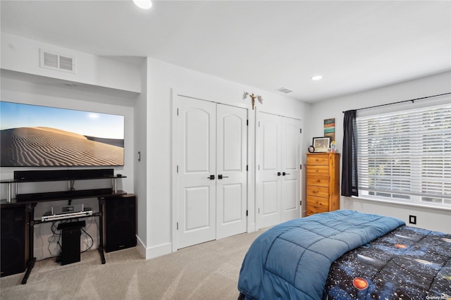 bedroom with light carpet