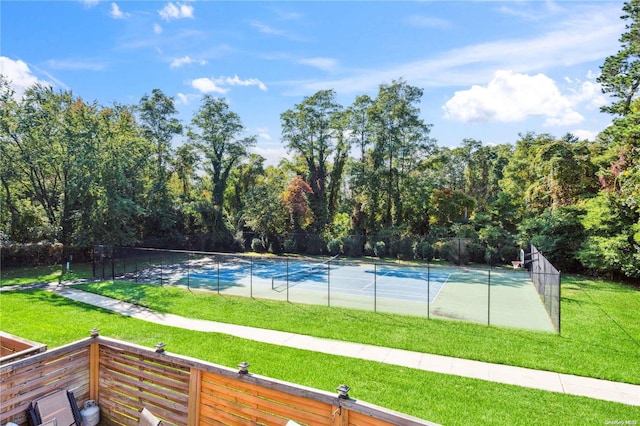 view of pool featuring a yard and tennis court