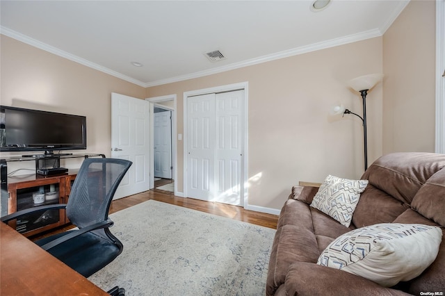 office area with hardwood / wood-style flooring and ornamental molding