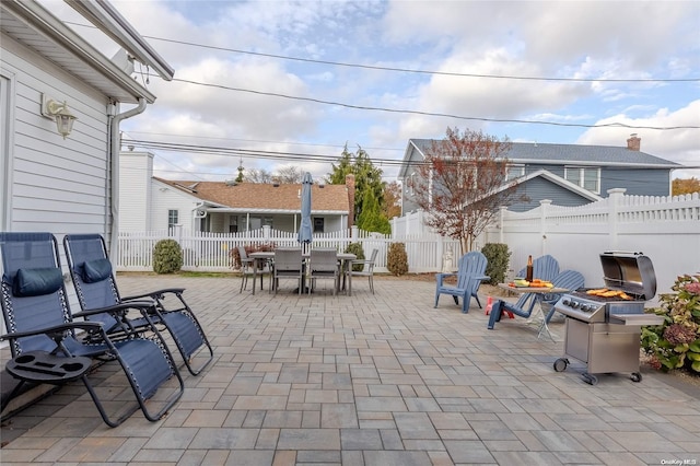 view of patio / terrace with a fire pit and area for grilling