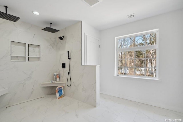 bathroom featuring tiled shower