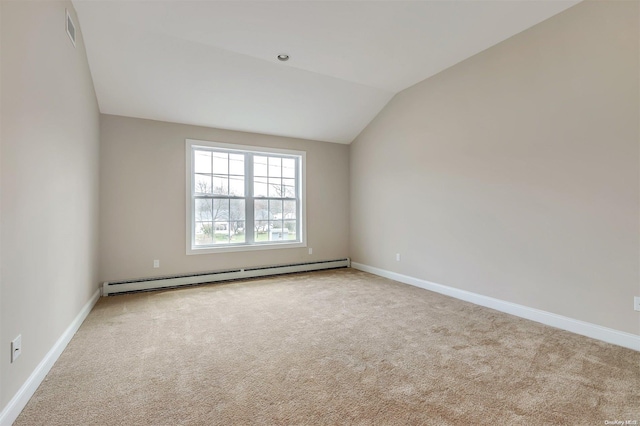 unfurnished room with lofted ceiling, a baseboard radiator, and light colored carpet