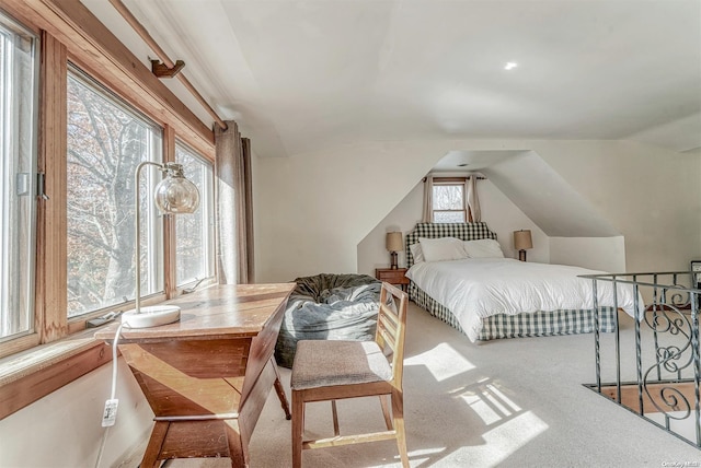 bedroom featuring carpet flooring and vaulted ceiling