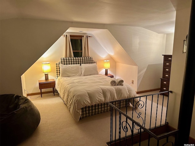 bedroom featuring carpet and vaulted ceiling