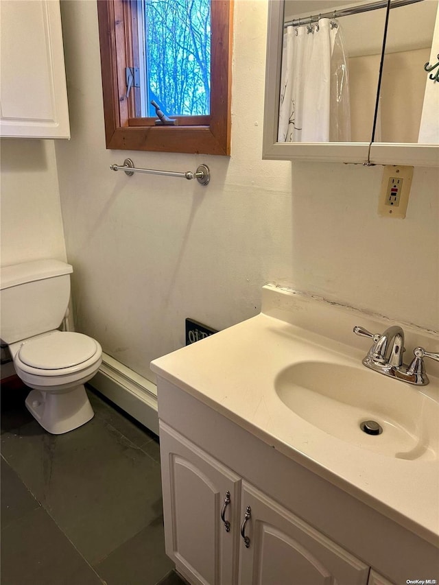 bathroom with vanity, a shower with shower curtain, and toilet