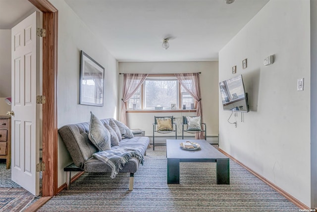 carpeted living room featuring a baseboard radiator