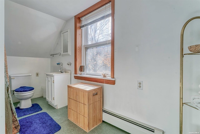 bathroom featuring baseboard heating, vanity, vaulted ceiling, and toilet