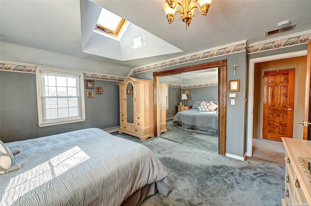 bedroom featuring a baseboard heating unit, light colored carpet, lofted ceiling with skylight, and a closet