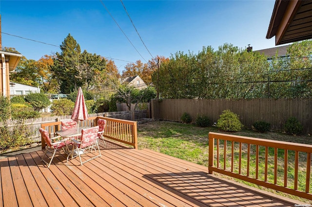 deck featuring a lawn