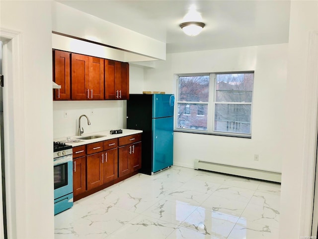 kitchen with a baseboard heating unit, black fridge, sink, stainless steel range oven, and extractor fan