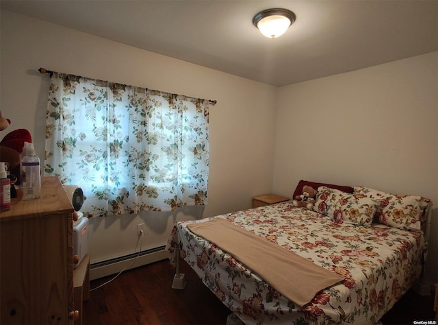 bedroom featuring dark hardwood / wood-style flooring and baseboard heating