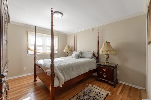 bedroom featuring hardwood / wood-style flooring and crown molding