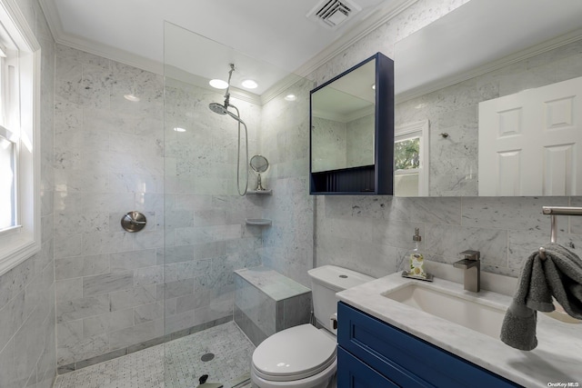 full bath featuring visible vents, crown molding, walk in shower, toilet, and tile walls
