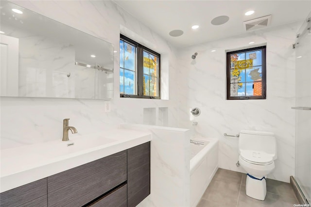 full bathroom featuring vanity, plus walk in shower, tile patterned floors, toilet, and tile walls