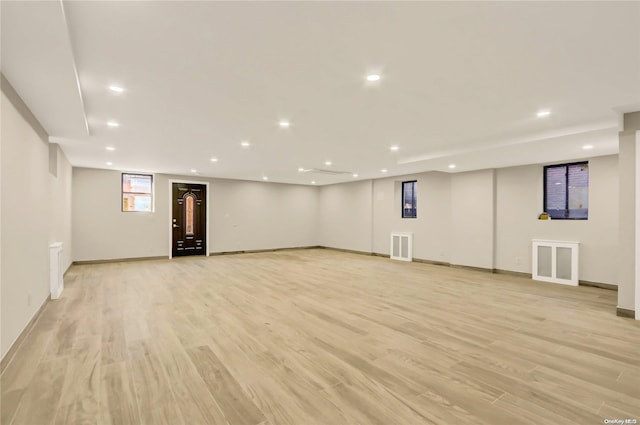 basement featuring light hardwood / wood-style flooring