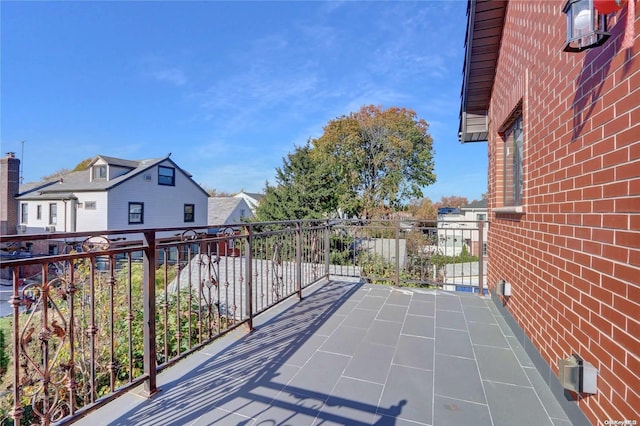 view of patio featuring a balcony