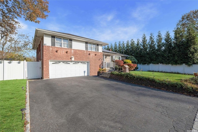 view of front facade featuring a garage and a front lawn