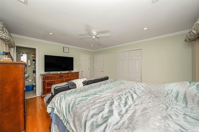 bedroom with a closet, light hardwood / wood-style flooring, ceiling fan, and ornamental molding