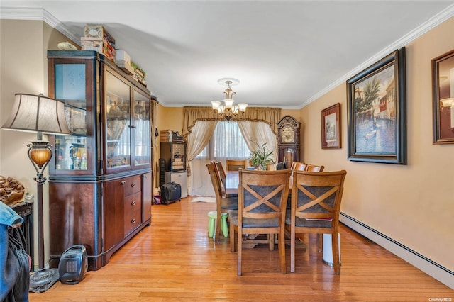 dining space featuring a notable chandelier, crown molding, baseboard heating, and light hardwood / wood-style flooring