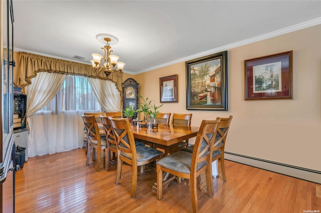 dining space featuring baseboard heating, a chandelier, ornamental molding, and light wood-type flooring