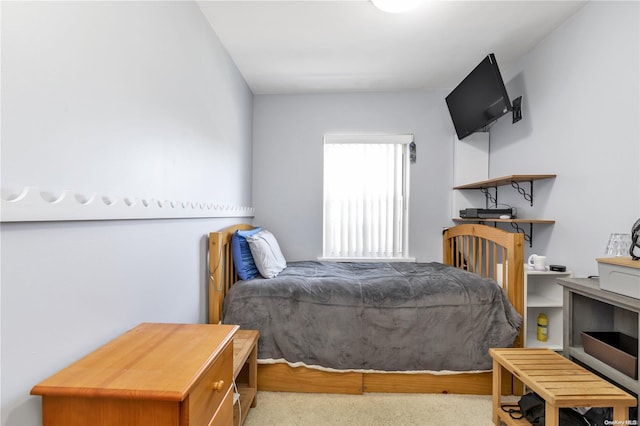 bedroom featuring light carpet