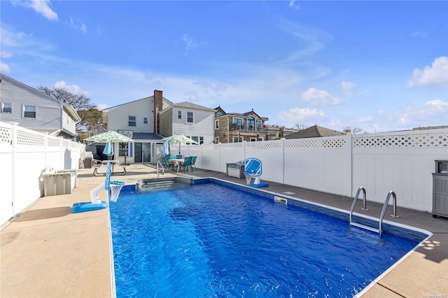 view of pool featuring a patio area