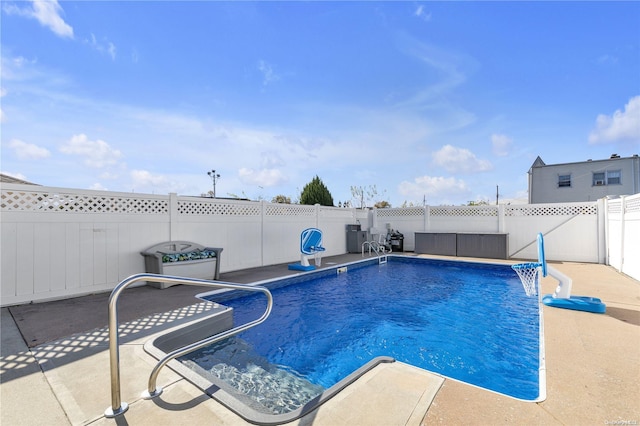 view of swimming pool with a patio area