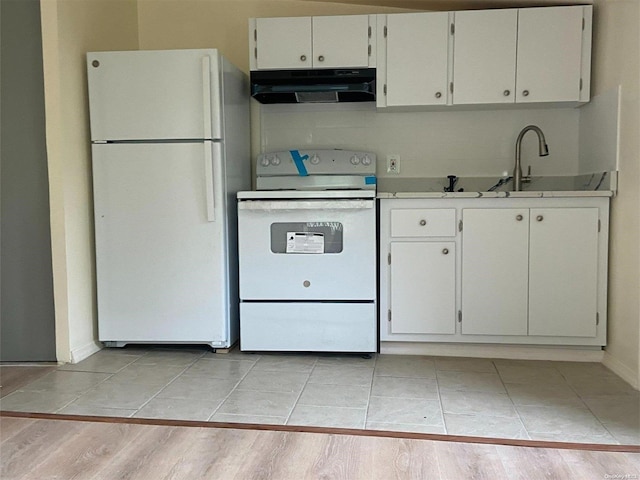 kitchen featuring white cabinetry, sink, light hardwood / wood-style floors, and white appliances