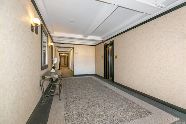 hallway featuring beamed ceiling and elevator