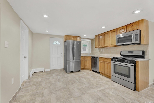 kitchen featuring backsplash and appliances with stainless steel finishes