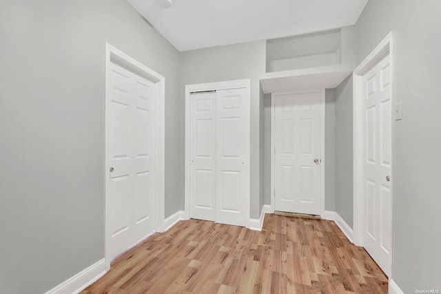 corridor featuring light hardwood / wood-style flooring