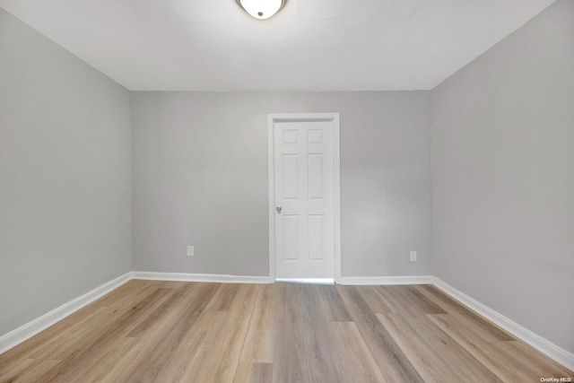 unfurnished room with light hardwood / wood-style floors