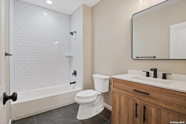 full bathroom featuring tile patterned flooring, vanity, tiled shower / bath combo, and toilet