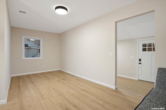 unfurnished room featuring light wood-type flooring