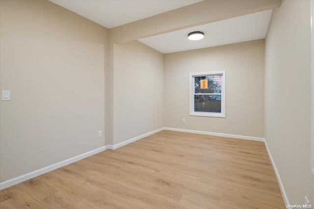 unfurnished room with light hardwood / wood-style flooring